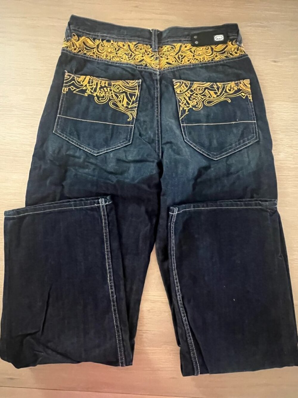 Ecko Unlimited Jeans with Gold-colored Graffiti Embroidery Across the Back.